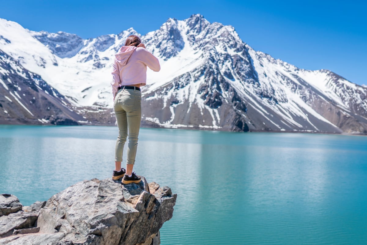 Woman standing in front of the mountains in Chile